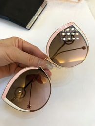 Lunettes de soleil œil de chat de luxe rose/blanc/or rose 58 mm Lunettes de soleil design pour femme neuves dans la boîte