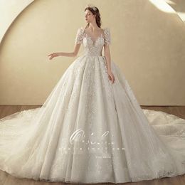 Luxe Princesse Robe De Bal Robe De Mariée Nouveau 2023 Dubaï Robe Brillante Paillettes Sweatheart Cou À Manches Longues Perles Balayage Train Robes De Mariée Robes De Mariée En Cristal