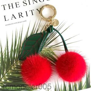 Luxe réel fourrure de renard boule pompon 9 couleurs véritable vison porte-clés cerise fruits métal porte-clés pendentif sac charme femmes F332 231222 3JTT