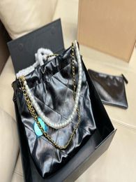 Designers de sacs de shopping de luxe pour femmes sacs poubelle diamant motif or gol ton métal chaîne 22 sacs à dos concepteur heureux