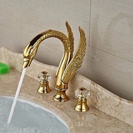 Robinet de lavabo répandu à montage sur pont de style cygne de luxe à deux poignées mitigeurs de lavabo dorés