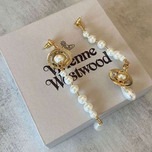Pendiente de lujo de Viviannes Westwoods Emperatriz viuda Xis Pendientes de perlas asimétricos Saturno 3D Pendientes de gota de agua de diseño pequeño y único exagerados
