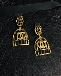 Bijoux de mariage de luxe Boucles d'oreilles cage à oiseaux dorées Accessoires de mode pour dames de créateurs avec boîte 04162722338484260394