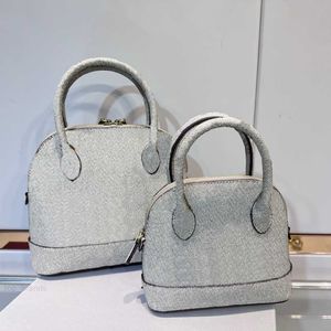 Bolso de lujo para mujer Diseño de moda Bolsas de concha 2 Tamaño Bolso de mano de diseñador famoso Cartera de embrague para damas Maletín de hombre de alta calidad Mochila