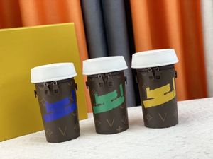 Luxurys Designer Coffee Cup Shout Bag Everyday Capsule Series Automne / Hiver Coffee Cup Sac à main Série Monogrammes Cuir enduit Sac à bandoulière réglable amovible