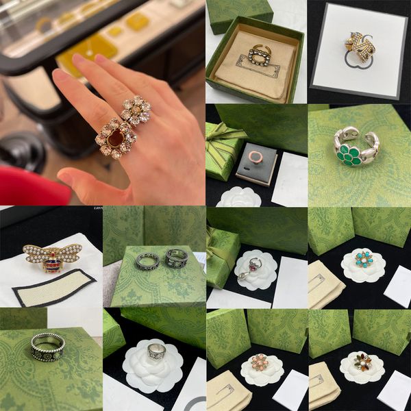 Diseñadores de lujo Anillos de banda Moda Hombres Mujeres Titanio Acero Margarita Grabado Carta Patrón Amantes Joyería Anillo estrecho Sin caja