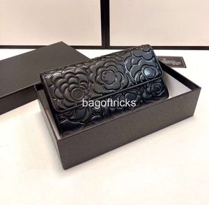 Luxurys Designers Mode Véritable Portefeuille pliant en cuir véritable Porte-monnaie mignon Porte-carte de crédit pour femmes Sac à bandoulière