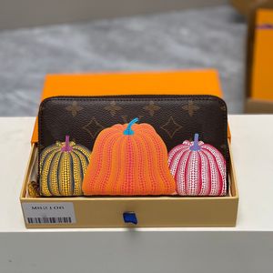 Luxurys Designers portefeuilles zippy pour femmes sacs portefeuilles sacs dorés citrouille à fermeture éclair pour femmes de voyage de voyage porte-monnaie avec boîte d'origine 82106
