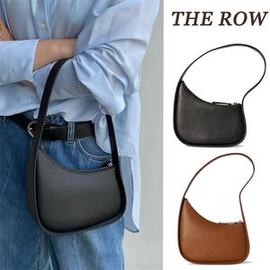 The Row White en cuir en cuir en cuir en cuir en cuir en cuir blanc portefeuille sac à main sac à main