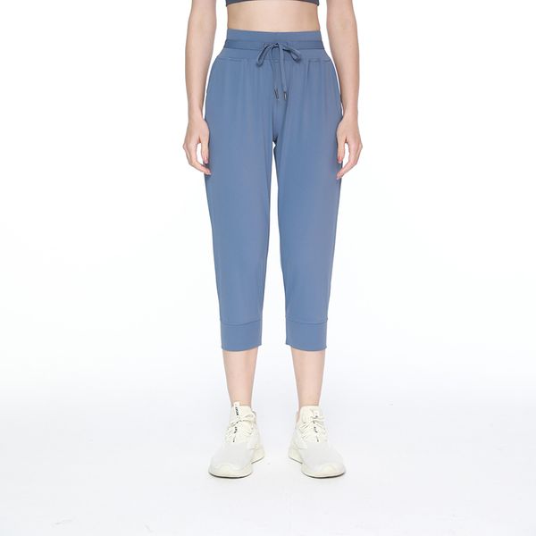 Livraison gratuite Pantalon de jogger pour femmes de yoga en tissu lycra.