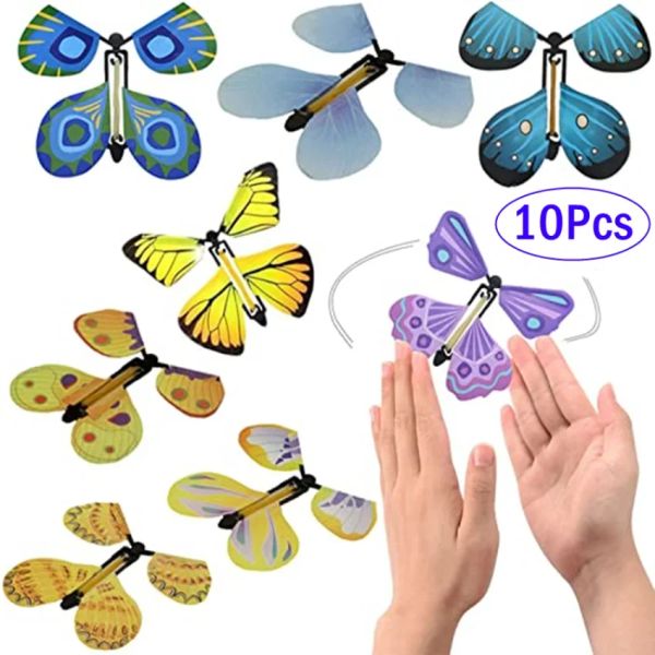 Magic Wind Up Flying Butterfly dans le livre de l'élastique Powered Magic Fairy Flying Toy Great Surprise Gift Party Favor