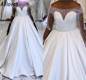 Perles majeures robes de mariée robe de bal africaine avec illusion manches longues col transparent filles noires formelle église robe de mariée satin bouffée chapelle train robes CL0724