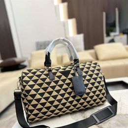 Uomo Donna Borsa da viaggio ricamata da 45 cm Borsone in tessuto beige nero Manici in pelle Designer di bagagli Tote con tracolla301q