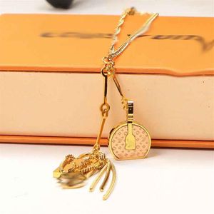 Fabricants de mode européenne et américaine, accessoires simples, serrure ronde pour sac à gâteau, pendentif en acier inoxydable, collier de couple la252U