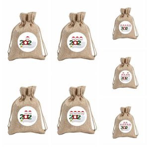 Máscara Familia Bolsa de regalo de Navidad Bolsillo con cordón Bolsas de dulces Muñeco de nieve Árbol Decoración Colgante Ornamentparty Pintura Decoración Accesorios LSK1522