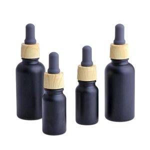 Botella de perfume de aceite esencial líquido de vidrio negro mate con gotero de pipeta de reactivo y tapa de grano de madera 10/30 ml Bthih