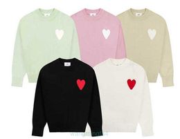Suéteres para hombres y mujeres Nueva marca de moda Suéter Camisas de punto de diseñador Manga larga Bordado francés Amis Patrón de corazón Cuello redondo Suéter de punto