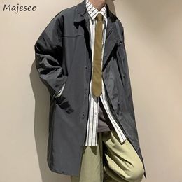 Hommes noir longue tranchée col rabattu manteaux à glissière Vintage Chic Cargo beau coupe-vent mâle décontracté Streetwear automne S-3XL 240122