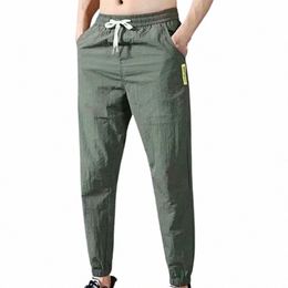 Hombres Pantalones casuales 2022New Color Sólido Multi Bolsillo Cordón Tobillo Tie Cargo Pantalón Pantalones Verano Pantalones de peso más calientes Plus Tamaño i3SU #