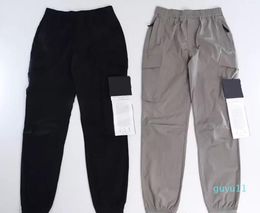 Pantalons pour hommes Konng Gonng Multi Big Pocket Salopettes Pantalons Printemps et été Nouvelle marque de mode