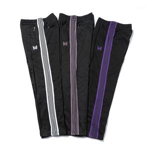 Pantalons décontractés pour hommes Streetwear AWGE Pantalons de survêtement Femmes Hommes Pantalon à glissière rayé Papillon Broderie Joggers Aiguilles Pantalon1