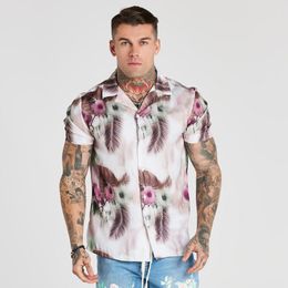 Chemises décontractées pour hommes Chemise à fleurs hawaïennes pour hommes et femmes Tendance rétro Loose Beach Travel Top à manches courtes pour hommes