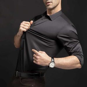 Chemises décontractées pour hommes Nouvelle chemise de traîneau longue élastique pour hommes mode affaires loisirs couleur unie non ing professionnel hommes chemise blancheC24315