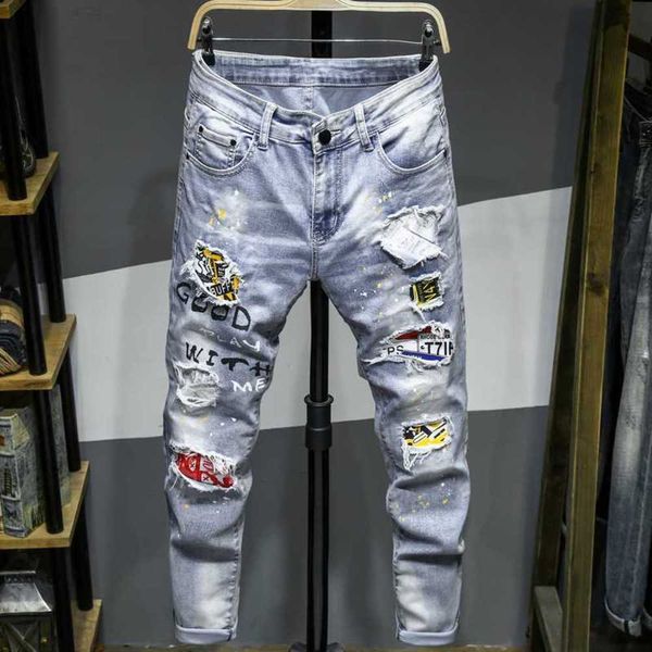 Pantalones de moda de diseñador para hombres, pantalones vaqueros pintados con aerosol blanco molido, marca de lujo para hombres con agujeros, agujeros de calidad