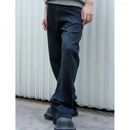 Jeans masculin 2024 noir avec un design légèrement évasé et un effet de traction de jambe intégré polyvalent non difficile en forme de corps