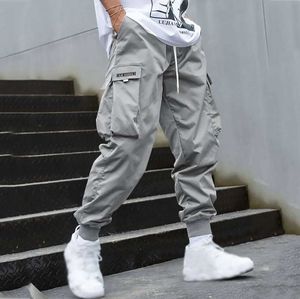 Jeans masculins 2024 Fashion Mens Pantalon de cargaison pantalon hip hop jogger pocheur violet pour hommes pantalons sportifs de rue coréenne pantalon de longueur de cheville j240507