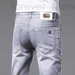 Heren jeans ontwerper 2022 Spring nieuwe heren jeans kleine voet slanke fit katoen elastisch tide merk Koreaanse jeugd dubbele g hybride broek dqw4