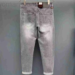 Jeans pour hommes Designer 2023 Mode Jeans classiques Style masculin Trou d'impression chaude peint Slim Stretch imprimé petits pieds Denim WZMF