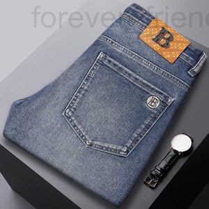 Heren jeans ontwerper 2024 high -end merk lente/zomer nieuwe vrije tijd slank fit kleine voet geborduurde blauwe elastische dunne stijl 44S3