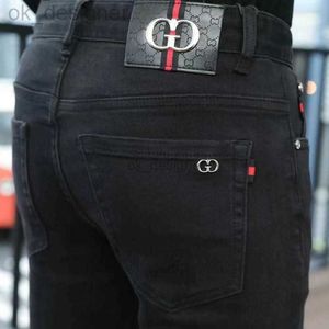 Heren jeans ontwerper herfst nieuwe herenbroeken high-end goederen puur zwart hoog elastisch slanke fit heren jeans modetrend merk