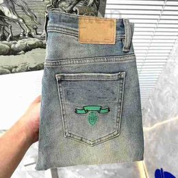 Jeans pour hommes Designer classique bleu triangle lettre jeans slim stretch texture droite lavage résistant à l'usure rangée supérieure patch moto vintage pantalon d'affaires 3HI7 9IJY