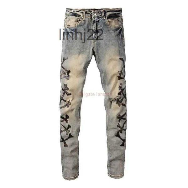 Jeans para hombres Ropa de diseñador Amires Denim Amies High Street Camuflaje Hueso con cuchillo de cuero Agujeros cortados Lavado en viejo Me6ONY