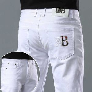 Designer de jeans pour hommes Designer 2023 printemps et été jeans pour hommes version coréenne de luxe léger pantalon blanc pur en coton mince élastique mince