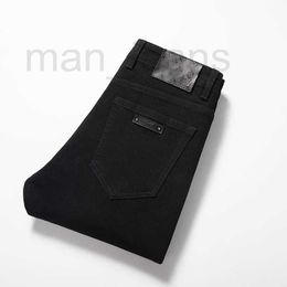 Jeans pour hommes Jeans de créateur automne nouveaux pieds ajustés élastiques pantalons à la mode noir pur WH4T