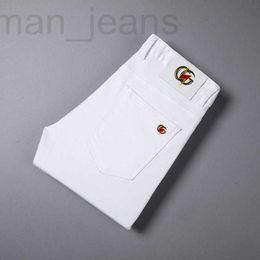 Herenjeans designer Koreaanse heren herfst en winter nieuwe zwarte witte jeans tieners persoonlijkheid mode elastisch slim fit kleine voet rechte buis IT3U