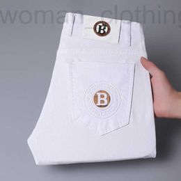 Heren jeans ontwerper lente en zomer nieuwe jeans licht luxe Koreaanse versie dunne elastische voet afslank katoen pure wit 76SA