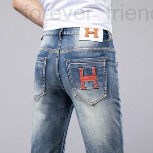 Designer de jeans masculin printemps nouvelle marque élastique à la mode polyvalente Broidered slim fit small pieds pantalon coréen édition Instagram long 0c8t