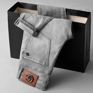 Heren jeans ontwerper lente zomer elastische slanke fit luxe Europese high -end Koreaanse grijze kleine voeten lange broek 5rtk