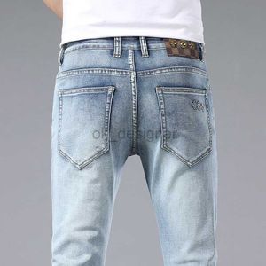 Designer de jeans masculins printemps / été en jeans pour hommes droits de la jambe droite Slim Fit élastique pantalon polyvalent