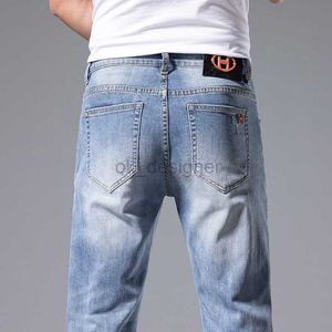 Designer de jeans masculin printemps / été Nouvelle mode décontractée petite jambe droite slim élastique slim fit pour un pantalon polyvalent masculin