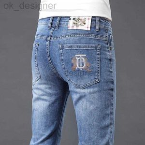 Heren jeans ontwerper zomers jeans slank fit borduurwerkmodemerk elastische kleine rechte been broek veelzijdige high -end casual broek voor mannen