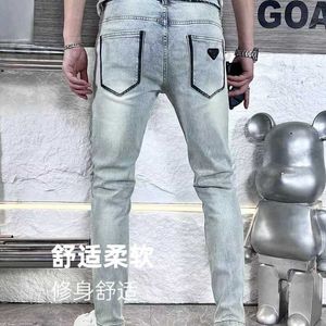 Heren jeans ontwerper trendy merk verontruste gewassen gele modder slanke fit jeans voor heren jeugd lente en herfst bedrukte veelzijdige broek evej