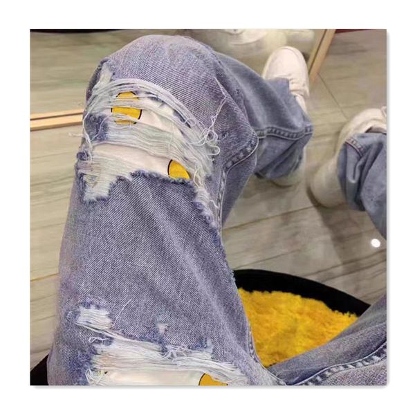 Jeans para hombres Fashin Diseñador Jeans para hombre con agujeros azules Patrón de cara sonriente Pantalones Hombres de moda Deportes Versátil Casual Delgado Largo Otoño