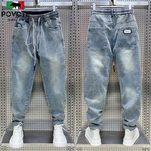 Heren jeans mode Koreaanse streetwear luxemerk heren trekkoord casual losse denim jeans voor lente en herfst stijlvolle vrachtbroek mannen 240423