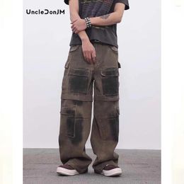 Jeans para hombres Pintura de spray de la industria pesada angustiada Dirty Fit Holggy Hip-Hop Diseño Seniente Pantalones de carga sueltos