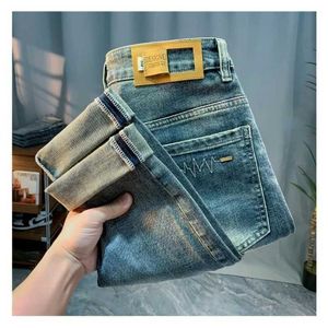 Men jeans high-end economy luxe jeans voor heren lente 2024 nieuwe ultradunne slanke fit leggings doorhangende casual modemerk geborduurde broek Q240509
